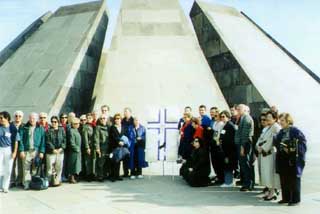 Participants of the Mission to Armenia stand by a wreath to be laid at the Genocide Memorial during a responsive reading at the Eternal Flame, in memory of the 1.5 million victims of the Armenian Genocide.