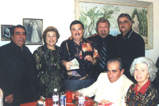 Christmas party donors 1. to r.: George Dadanian, hosts Virginia and Norman Matossian, Steve Balian, and Omar Knadjian; seated, George and Carolyn Krikorian