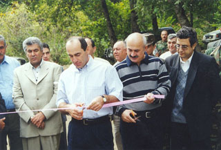 Constitutional Court Chairman Gagik Haroutiunian (l.) and 'Hayastan' All-Armenian Fund's Executive Director Vahan Der Ghevontian (r.) watch as President Robert Kocharian and Karabagh Prime Minister Anoushavan Danielian cut the ribbon at the official opening ceremonies of the water system at Khenadzagh