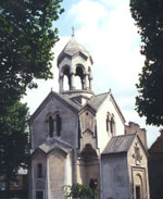 St. Sarkis Armenian Church stands amid rose bushes and fruit trees, has a school in back and, in its corner, a marble arch over a modern khachkar 'in memory of our compatriots who died for their faith and country.'